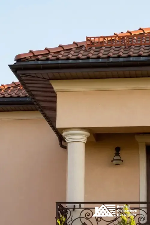 Elegant home with red tile roofing installed by skilled roofing professionals.